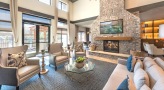 large clubhouse with fireplace and bright windows