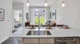 a kitchen island with pendant lighting