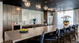 a kitchen with a long island in clubhouse