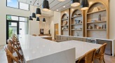 waterfall countertop with chairs in clubhouse kitchen