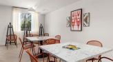 tables, chairs and supplies in art studio