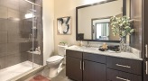 a bathroom with a glassed, walk-in shower