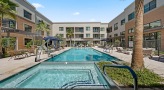 outdoor jacuzzi next to pool