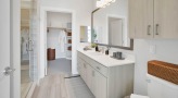a bathroom with a walk-in closet