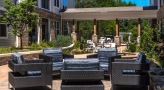 a patio with chairs and tables