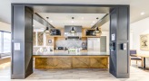 clubhouse kitchen with island and coffee counter