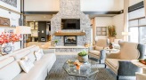 clubhouse with couch and chairs next to fireplace