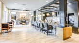 long bar counter with chairs at clubhouse kitchen