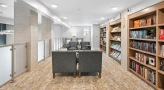 library area with tables, chairs and bookshelves