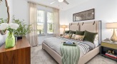 bright, carpeted bedroom