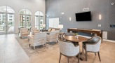 spacious clubhouse with tables and chairs