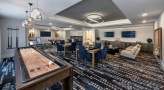 game room with a shuffleboard table
