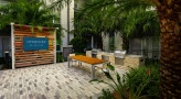 large patio with seating and tv