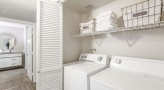 washer and dryer with a slef above