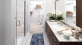 Large bathroom with double vanity sinks and a large mirror