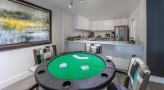 a kitchen and dining area with a card table