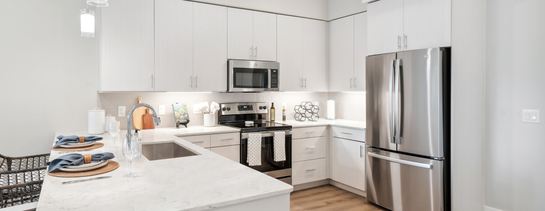 Model kitchen at Overture North Scottsdale senior community in Arizona, featuring stainless steel appliances. 