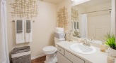 bathroom with a large mirror