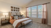 Large bedroom with carpeted floors 