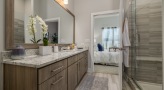 Contemporary bathroom design, with dual vanities and walk-in shower