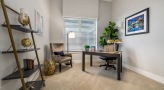 Secondary room with bookshelf and office set up