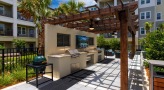 large grill stations with bar seating and TV's