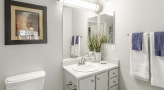 bathroom with a large mirror