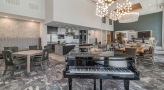 Grand Piano sitting in the lounge 