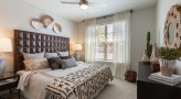Large bedroom with carpeted floors 