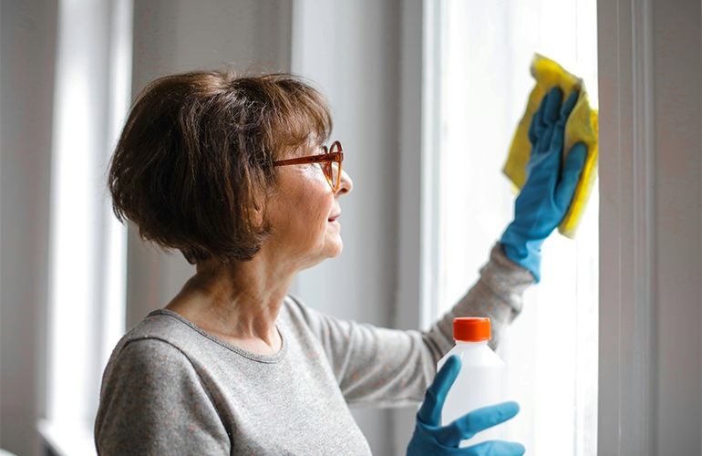 woman cleaning window
