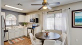 kitchen and dining area with a large window