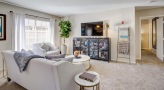 living room with a couch and a large window