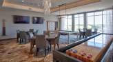 Game room with tabletop shuffle board and billiards