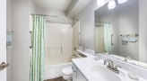 bathroom with a large mirror