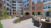 Large patio with fire pit and lounge seating