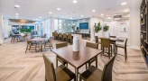 Well lit lounge with plenty of seating 