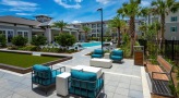large outdoor patio with seating and fire pit