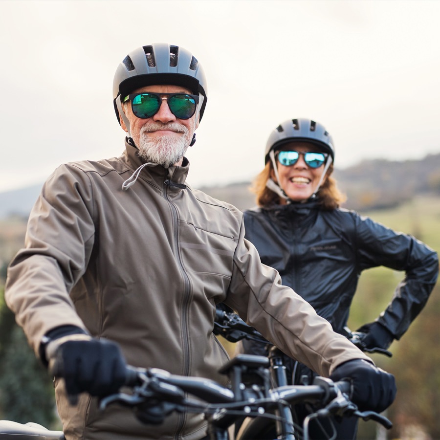 Las Vegas Senior couple wearing helmets and gear riding bicycles