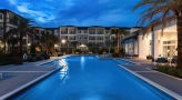 Large sparkling blue pool at night