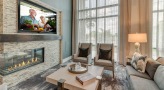 Seating area with a tv and fire place 