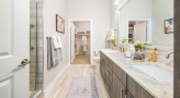 Large bathroom with double vanity sinks and a large mirror