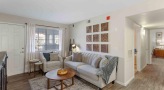 living room with a couch and a large window