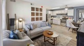 living room with a couch and a large window